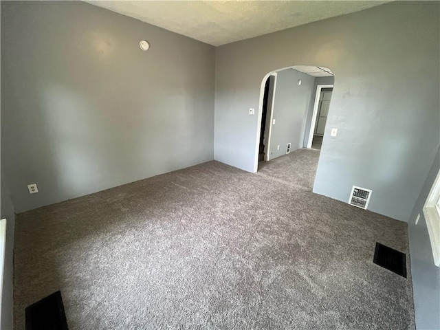 66-68 Ackerman St, Rochester, NY 14609 - carpeted empty room featuring arched walkways and a smoke detector
