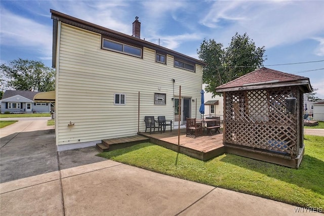 112 Nokomis Pkwy, Cheektowaga, NY 14225 - back of property with a deck, a chimney, a yard, and outdoor dining space