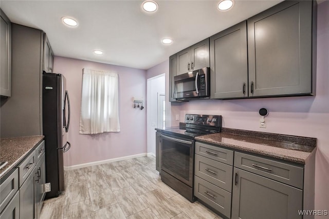 112 Nokomis Pkwy, Cheektowaga, NY 14225 - kitchen with stainless steel microwave, black electric range oven, freestanding refrigerator, recessed lighting, and gray cabinets