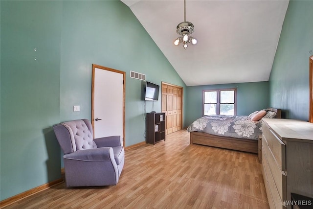 112 Nokomis Pkwy, Cheektowaga, NY 14225 - bedroom featuring high vaulted ceiling, light wood-style flooring, and a chandelier