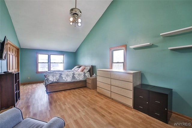 112 Nokomis Pkwy, Cheektowaga, NY 14225 - bedroom with high vaulted ceiling, multiple windows, and light wood-type flooring