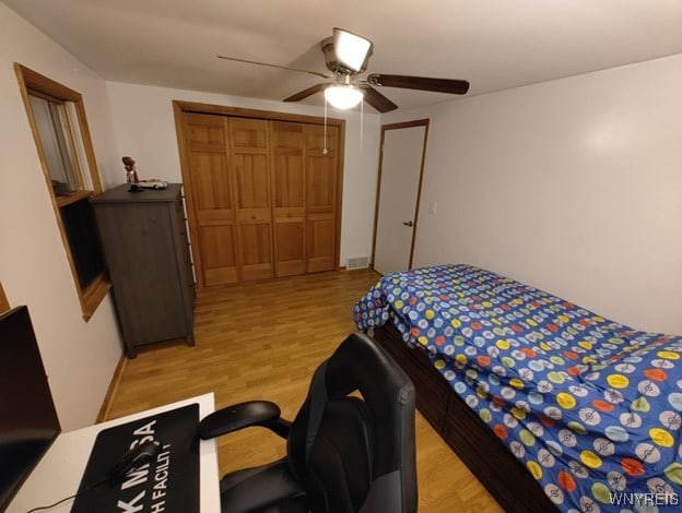 112 Nokomis Pkwy, Cheektowaga, NY 14225 - bedroom with light wood finished floors, ceiling fan, a closet, and a desk