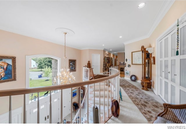 7 The Hamlet, Amherst, NY 14051 - hallway with an upstairs landing, a chandelier, carpet floors, recessed lighting, and crown molding