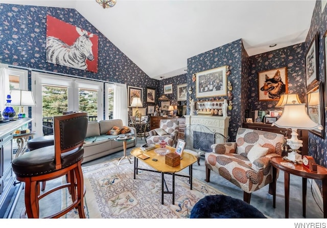 7 The Hamlet, Amherst, NY 14051 - living area featuring wallpapered walls, high vaulted ceiling, and a fireplace