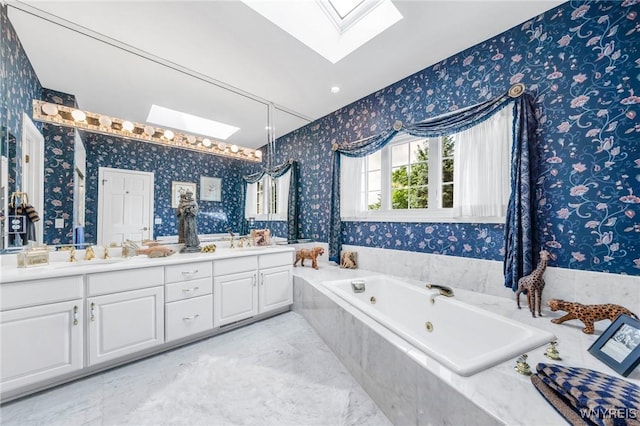 7 The Hamlet, Amherst, NY 14051 - bathroom featuring a skylight, wallpapered walls, double vanity, and a tub with jets