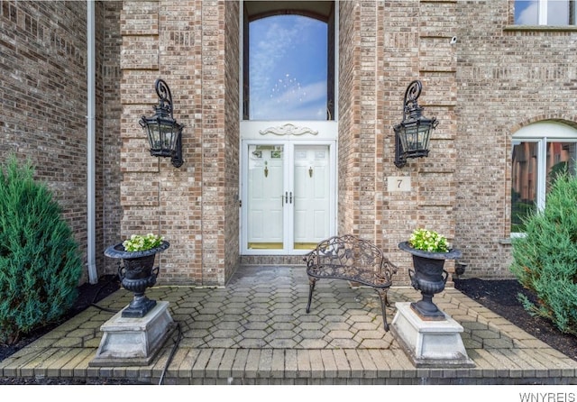 7 The Hamlet, Amherst, NY 14051 - view of exterior entry featuring brick siding