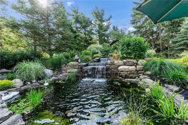 7 The Hamlet, Amherst, NY 14051 - view of yard with a small pond