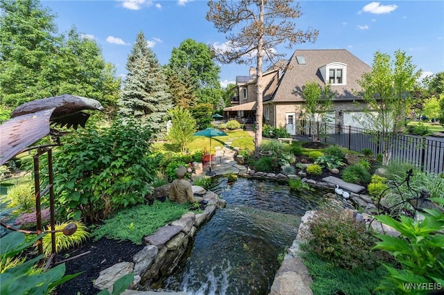 7 The Hamlet, Amherst, NY 14051 - view of yard featuring a garden pond