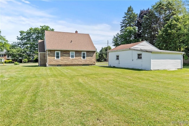 1419 Maple Rd, Amherst, NY 14221 - rear view of house with a lawn