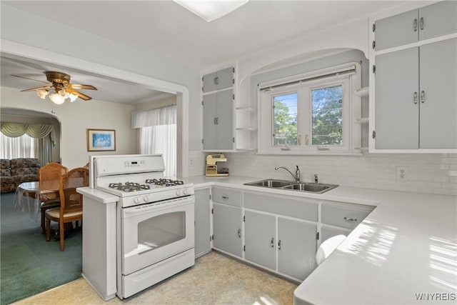 1419 Maple Rd, Amherst, NY 14221 - kitchen featuring white range with gas cooktop, arched walkways, and healthy amount of natural light
