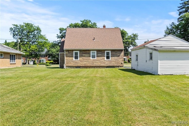 1419 Maple Rd, Amherst, NY 14221 - rear view of property featuring a yard, a chimney, and roof with shingles