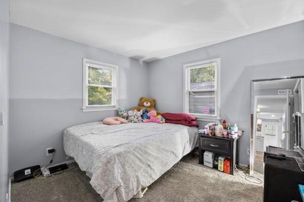 95 Ridgemar Rd, Greece, NY 14615 - carpeted bedroom with multiple windows