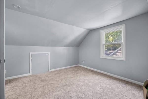 95 Ridgemar Rd, Greece, NY 14615 - additional living space with vaulted ceiling and carpet flooring