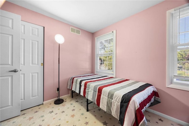 193 Orchard Creek Ln, Greece, NY 14612 - bedroom featuring baseboards and tile patterned floors