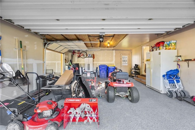 193 Orchard Creek Ln, Greece, NY 14612 - garage featuring white refrigerator with ice dispenser