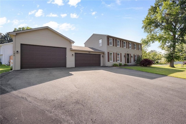 193 Orchard Creek Ln, Greece, NY 14612 - colonial inspired home with an attached garage, driveway, and a front yard