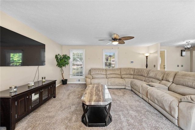 193 Orchard Creek Ln, Greece, NY 14612 - carpeted living room featuring ceiling fan and baseboards