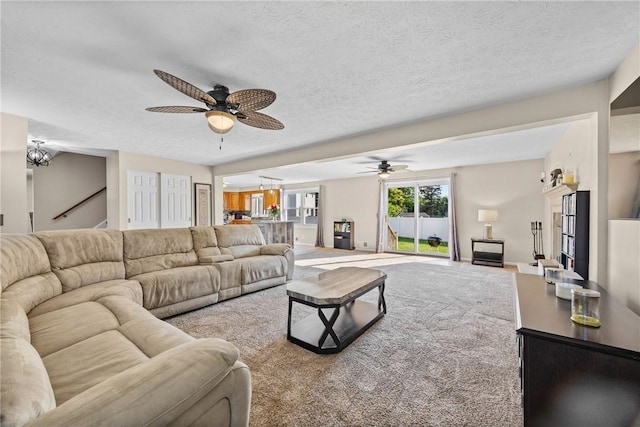 193 Orchard Creek Ln, Greece, NY 14612 - living room featuring ceiling fan, a textured ceiling, and a chandelier