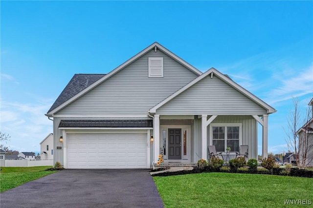 3398 Cedar Valley Way, Hamburg, NY 14075 - view of front of house with asphalt driveway, a garage, and covered porch