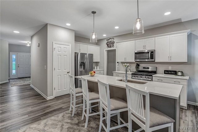 3398 Cedar Valley Way, Hamburg, NY 14075 - kitchen featuring stainless steel appliances, dark wood-type flooring, recessed lighting, light countertops, and white cabinetry
