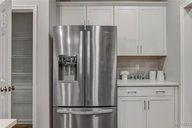 3398 Cedar Valley Way, Hamburg, NY 14075 - kitchen featuring stainless steel fridge with ice dispenser, light countertops, and white cabinetry