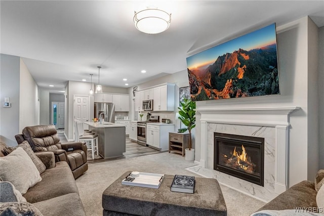 3398 Cedar Valley Way, Hamburg, NY 14075 - living area with recessed lighting, a fireplace, and light colored carpet