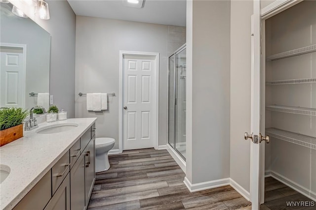 3398 Cedar Valley Way, Hamburg, NY 14075 - bathroom featuring a stall shower, wood finished floors, and double vanity