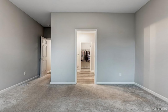 3398 Cedar Valley Way, Hamburg, NY 14075 - unfurnished bedroom featuring carpet floors and a spacious closet