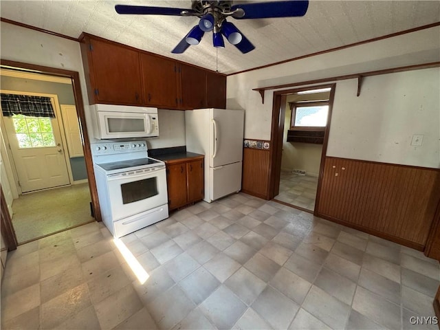 410 W Elm St, Oneida, NY 13421 - kitchen featuring white appliances, wainscoting, healthy amount of natural light, ornamental molding, and a ceiling fan