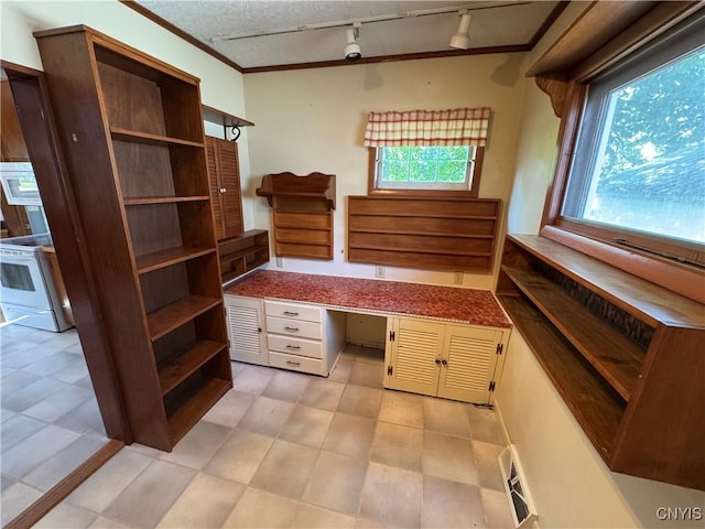410 W Elm St, Oneida, NY 13421 - unfurnished office with track lighting, built in desk, and crown molding