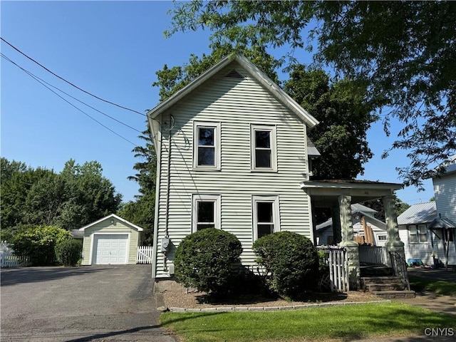 410 W Elm St, Oneida, NY 13421 - view of front facade featuring an outdoor structure, driveway, and a detached garage