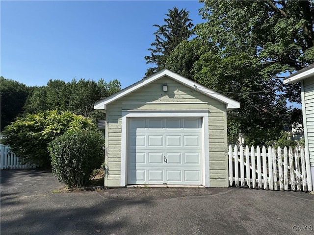 410 W Elm St, Oneida, NY 13421 - detached garage featuring asphalt driveway