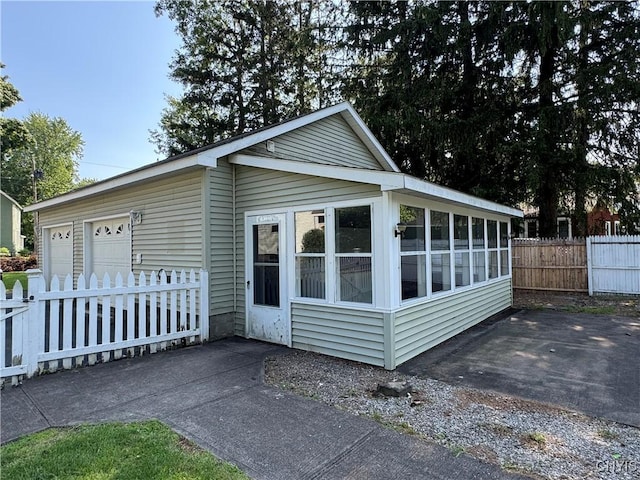 410 W Elm St, Oneida, NY 13421 - view of front of home with a sunroom