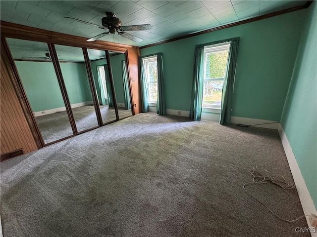 410 W Elm St, Oneida, NY 13421 - spare room with crown molding, carpet flooring, and a ceiling fan