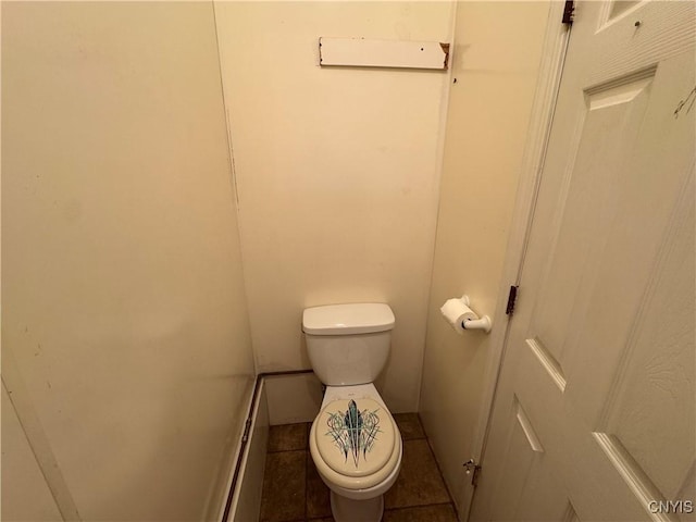 410 W Elm St, Oneida, NY 13421 - bathroom featuring toilet and tile patterned floors