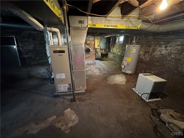 410 W Elm St, Oneida, NY 13421 - unfinished basement featuring gas water heater and electric panel