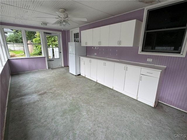 410 W Elm St, Oneida, NY 13421 - kitchen featuring stainless steel countertops, freestanding refrigerator, white cabinets, and a ceiling fan