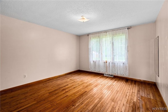 270 N French Rd, Amherst, NY 14228 - unfurnished room featuring hardwood / wood-style floors and a textured ceiling