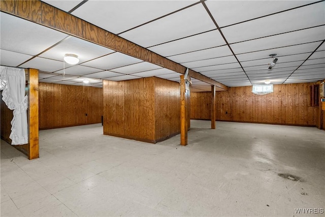 270 N French Rd, Amherst, NY 14228 - basement featuring a paneled ceiling, wood walls, and tile patterned floors