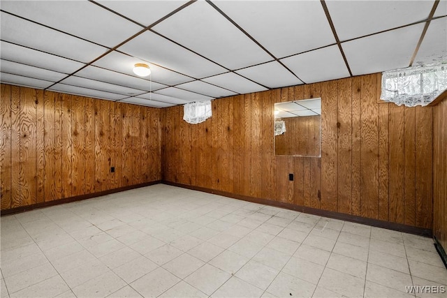 270 N French Rd, Amherst, NY 14228 - basement featuring light flooring, wood walls, and a drop ceiling