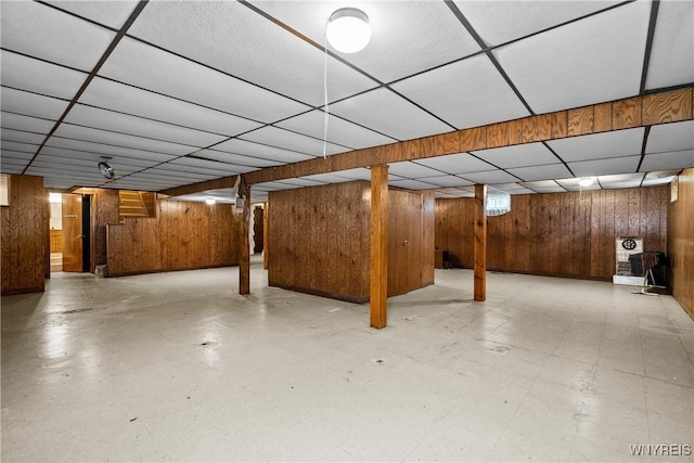 270 N French Rd, Amherst, NY 14228 - finished below grade area with a paneled ceiling, wooden walls, and tile patterned floors