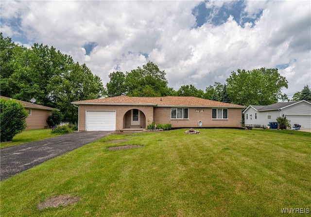 270 N French Rd, Amherst, NY 14228 - ranch-style house featuring a garage, asphalt driveway, brick siding, and a front lawn