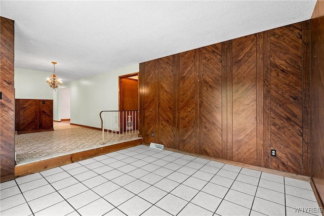 270 N French Rd, Amherst, NY 14228 - unfurnished room with a chandelier and wood walls