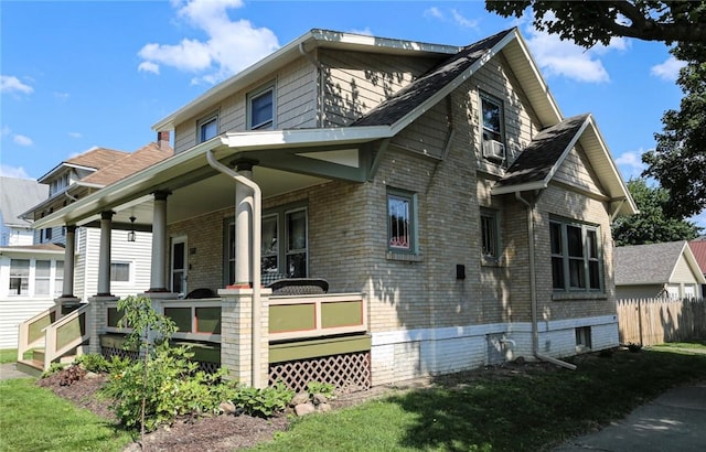 561 W Washington Ave, Elmira City, NY 14901 - view of property exterior featuring a porch and brick siding