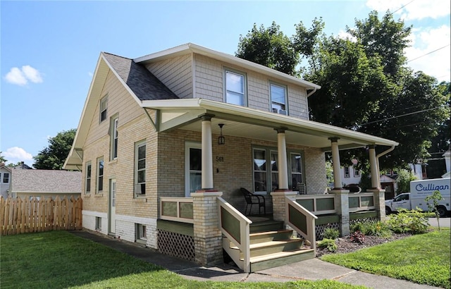561 W Washington Ave, Elmira City, NY 14901 - view of front of home featuring covered porch and brick siding