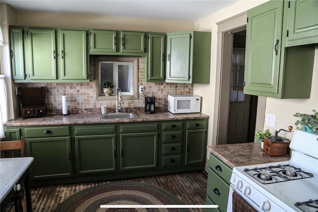 561 W Washington Ave, Elmira City, NY 14901 - kitchen featuring green cabinets, white appliances, decorative backsplash, and dark wood finished floors