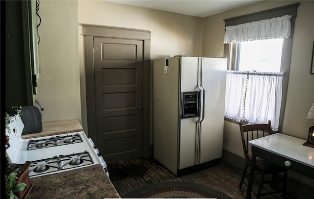 561 W Washington Ave, Elmira City, NY 14901 - kitchen with white appliances and dark wood-style flooring