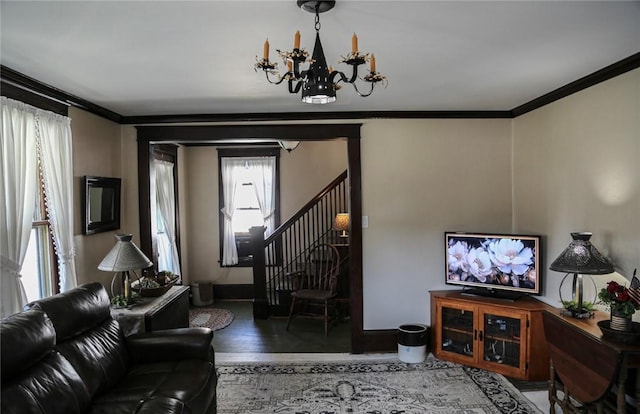 561 W Washington Ave, Elmira City, NY 14901 - living area featuring a chandelier, ornamental molding, stairway, and wood finished floors