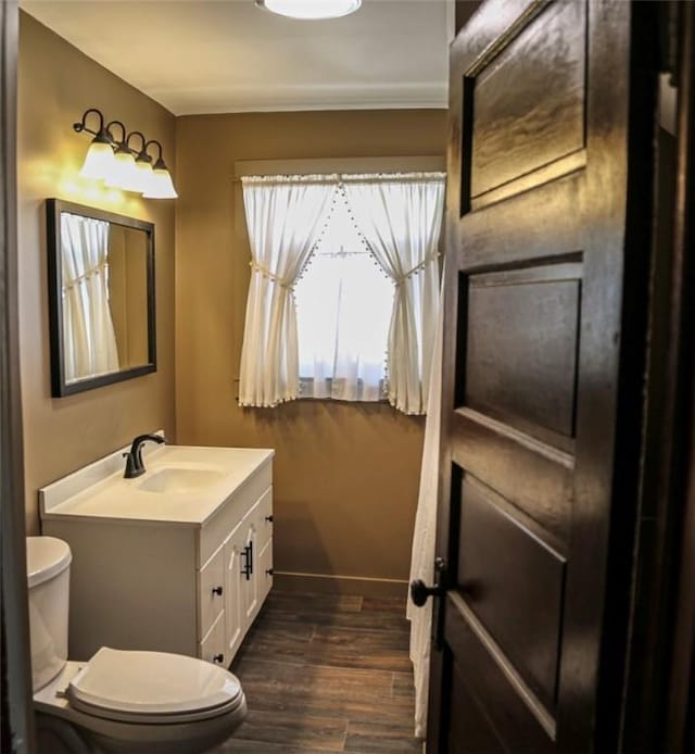 561 W Washington Ave, Elmira City, NY 14901 - bathroom featuring vanity and wood finished floors