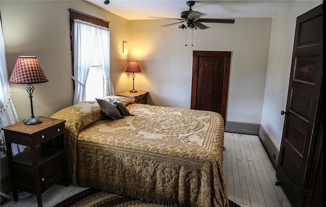 561 W Washington Ave, Elmira City, NY 14901 - bedroom with hardwood / wood-style floors and ceiling fan